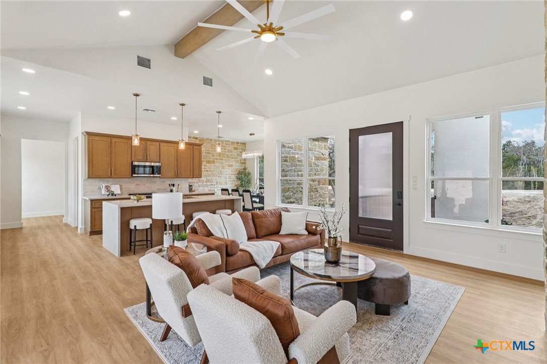 858 Rutherford Fischer, TX 78623 - Photo 13 of 37 a living room with furniture and a large window