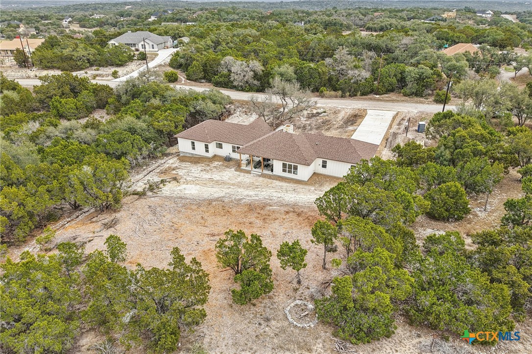 858 Rutherford Fischer, TX 78623 - Photo 33 of 37 an aerial view of residential houses with outdoor space