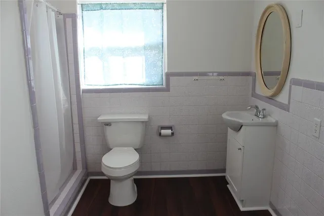 a bathroom with a toilet and a sink