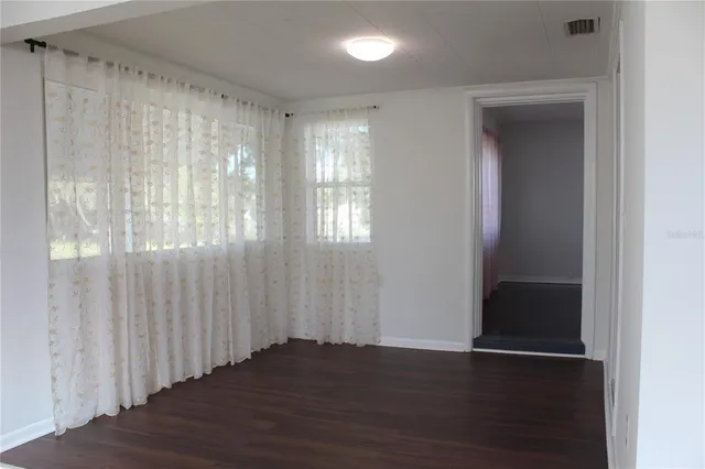 a view of entryway with wooden floor