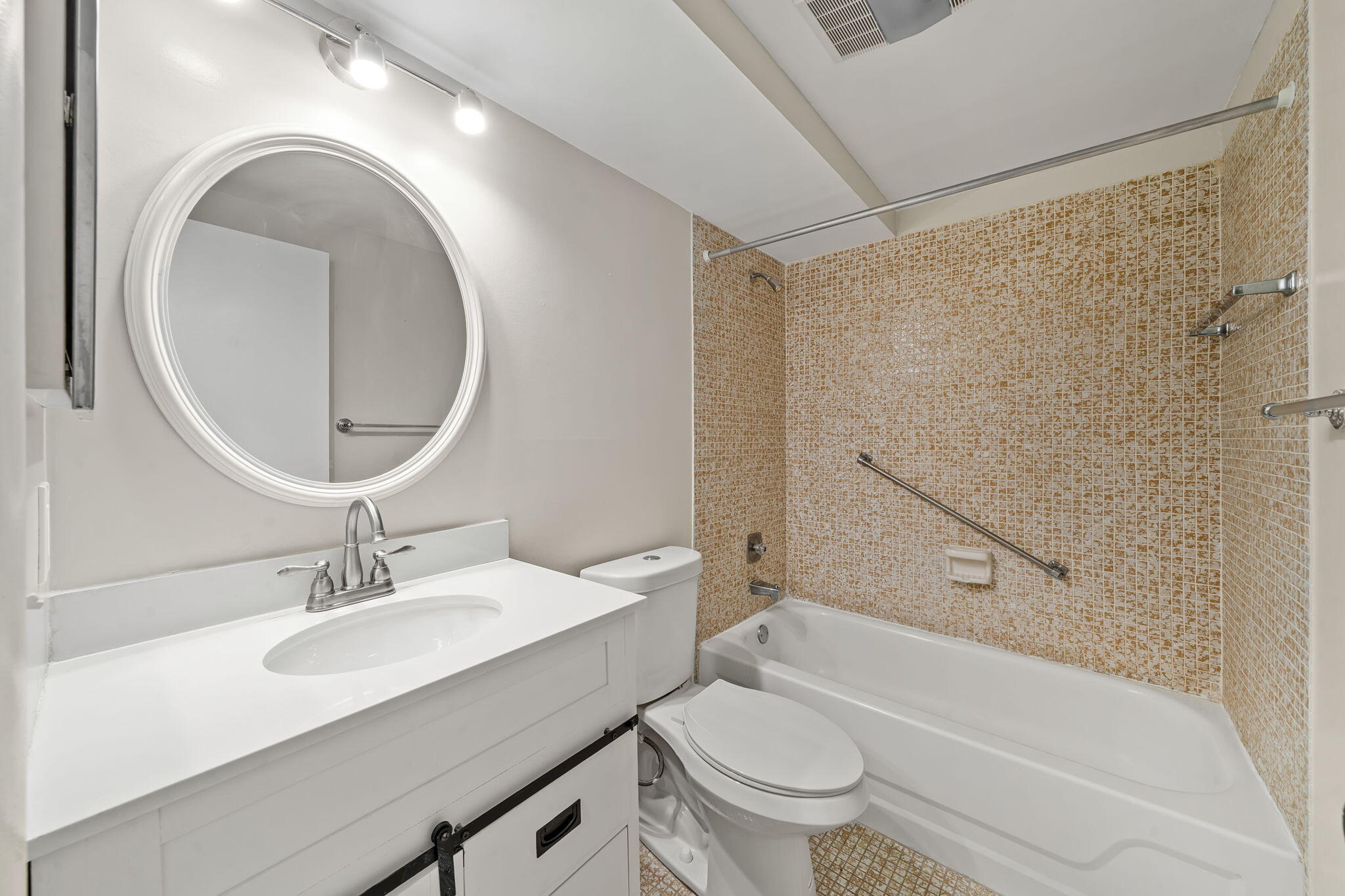 932 Flanders T Delray Beach, FL 33484 - Photo 11 of 28 a bathroom with a sink toilet and shower
