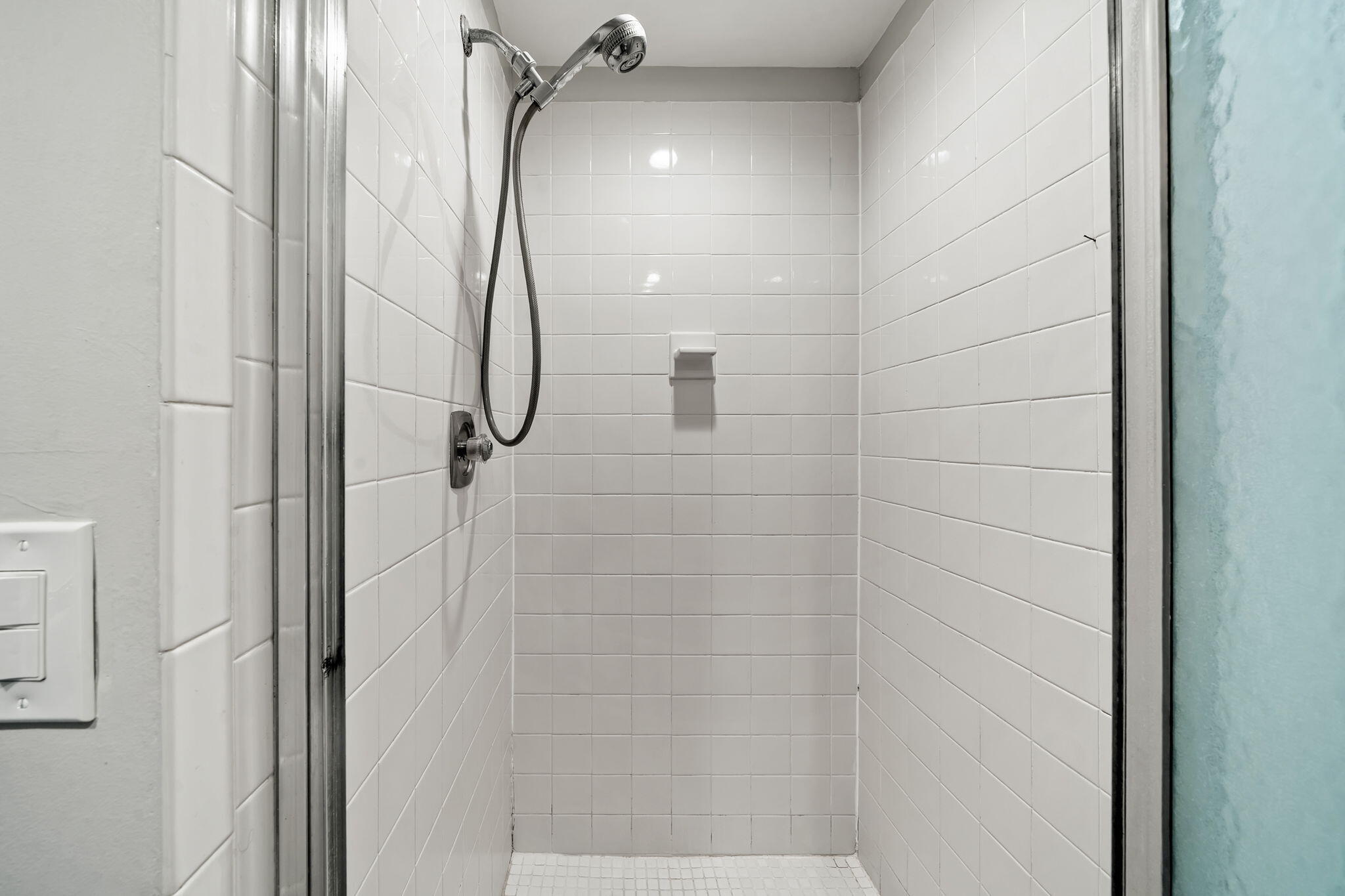 932 Flanders T Delray Beach, FL 33484 - Photo 14 of 28 a bathroom with a glass shower door