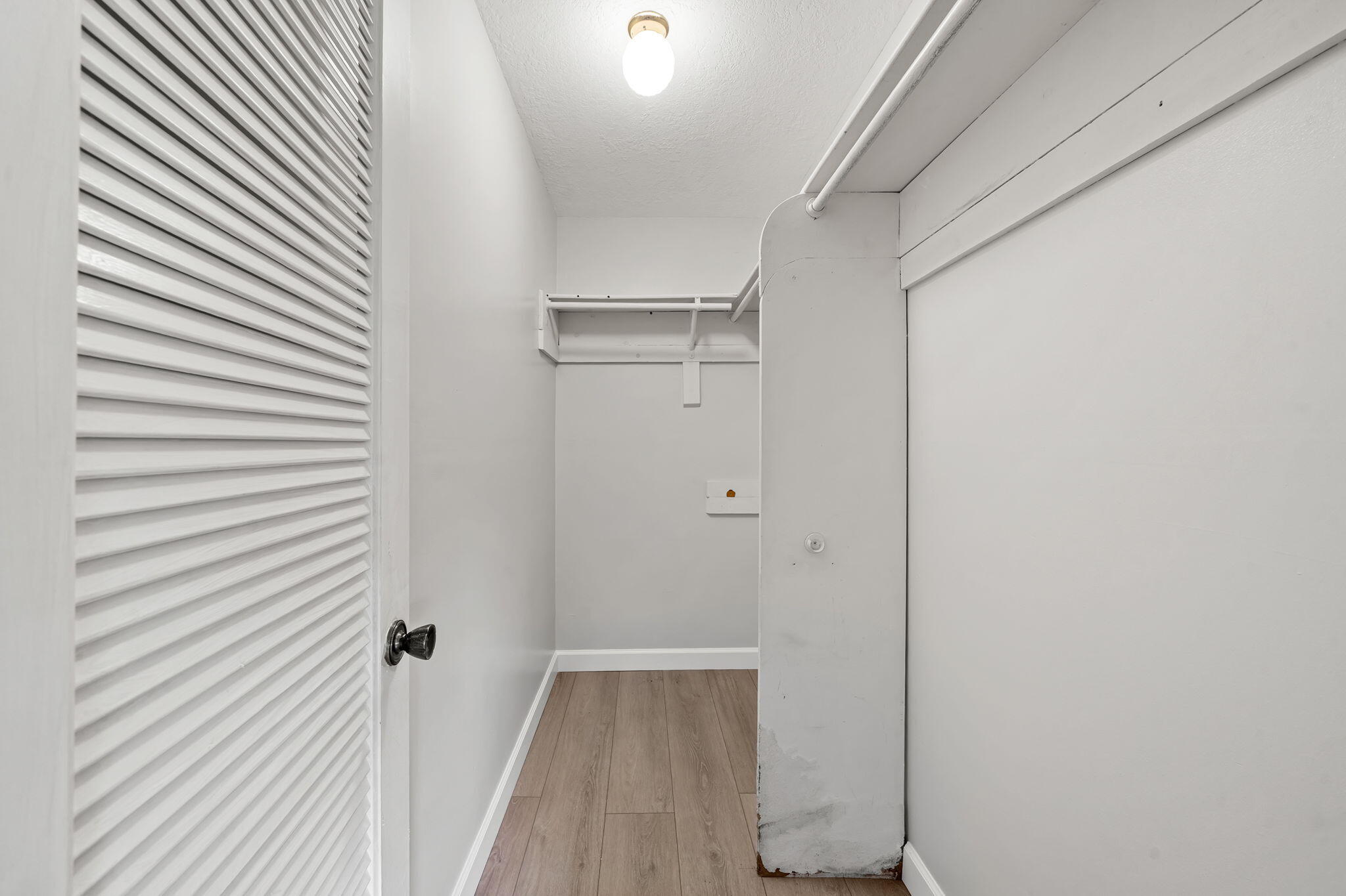 932 Flanders T Delray Beach, FL 33484 - Photo 17 of 28 a view of a hallway with wooden floor