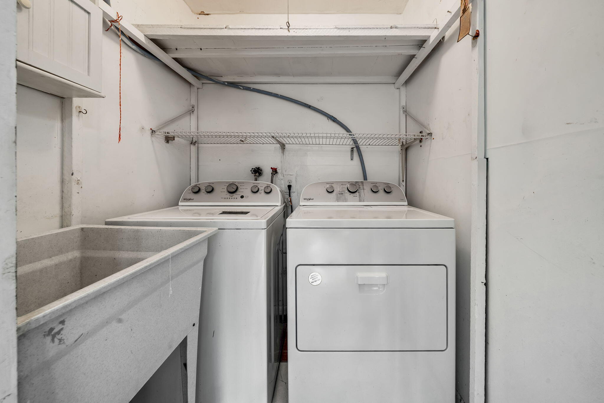 932 Flanders T Delray Beach, FL 33484 - Photo 19 of 28 a utility room with dryer and washer
