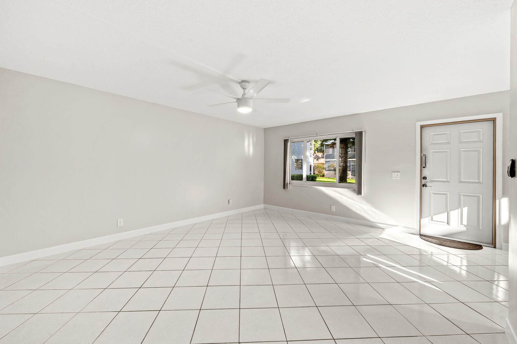 932 Flanders T Delray Beach, FL 33484 - Photo 10 of 28 a view of an empty room and window