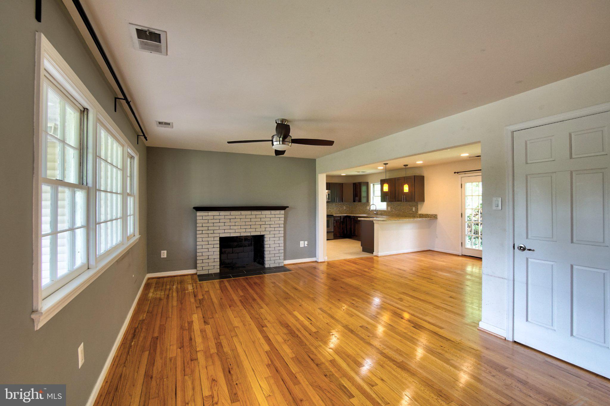900 Walker Road Great Falls, VA 22066 - Photo 5 of 52 Spacious living area with warm tones.