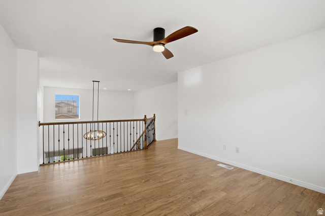 2007 Fielding Hill Lane Draper, UT 84020 - Photo 20 of 83 Spacious room featuring wood-finish flooring, a modern ceiling fan, and white walls