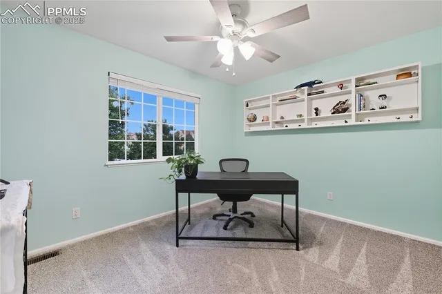 a view of a workspace with furniture