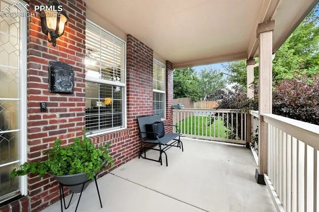 a view of a chair and table in the balcony