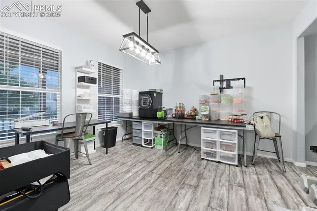 a view of a dining room with furniture window and wooden floor