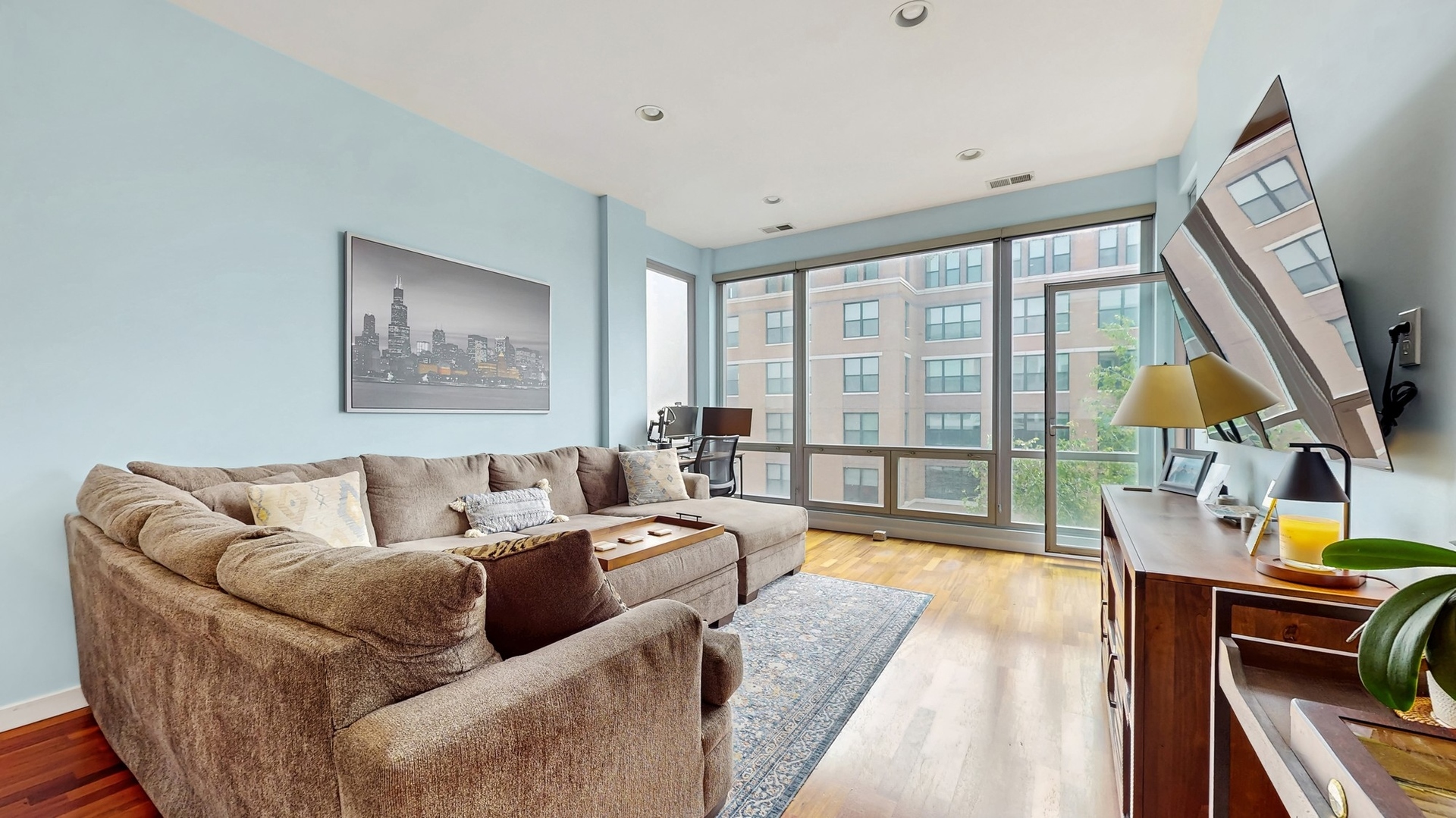 3920 North Sheridan Road, Unit 411 Chicago, IL 60613 - Photo 11 of 28 a living room with furniture and a floor to ceiling window