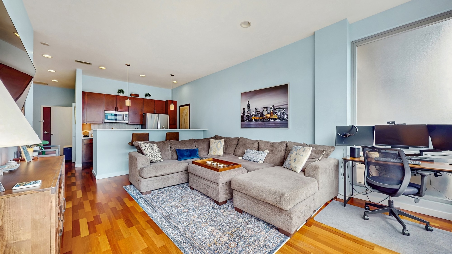 3920 North Sheridan Road, Unit 411 Chicago, IL 60613 - Photo 14 of 28 a living room with furniture and a flat screen tv