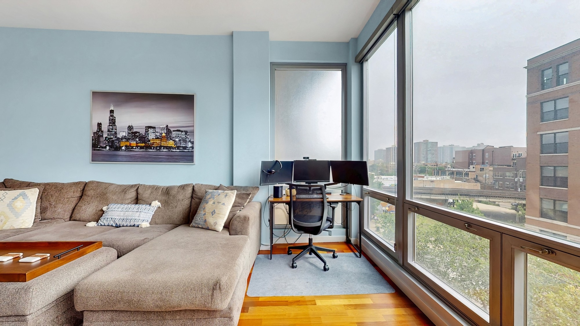 3920 North Sheridan Road, Unit 411 Chicago, IL 60613 - Photo 15 of 28 a living room with furniture and a large window