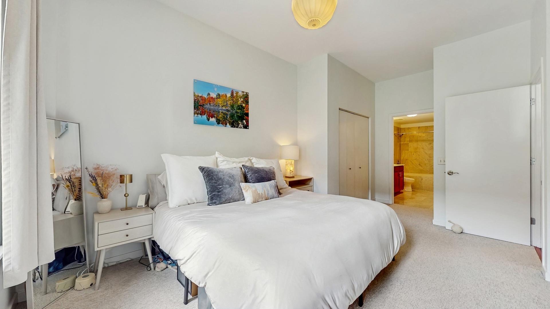 3920 North Sheridan Road, Unit 411 Chicago, IL 60613 - Photo 17 of 28 a bedroom with a bed and a couch