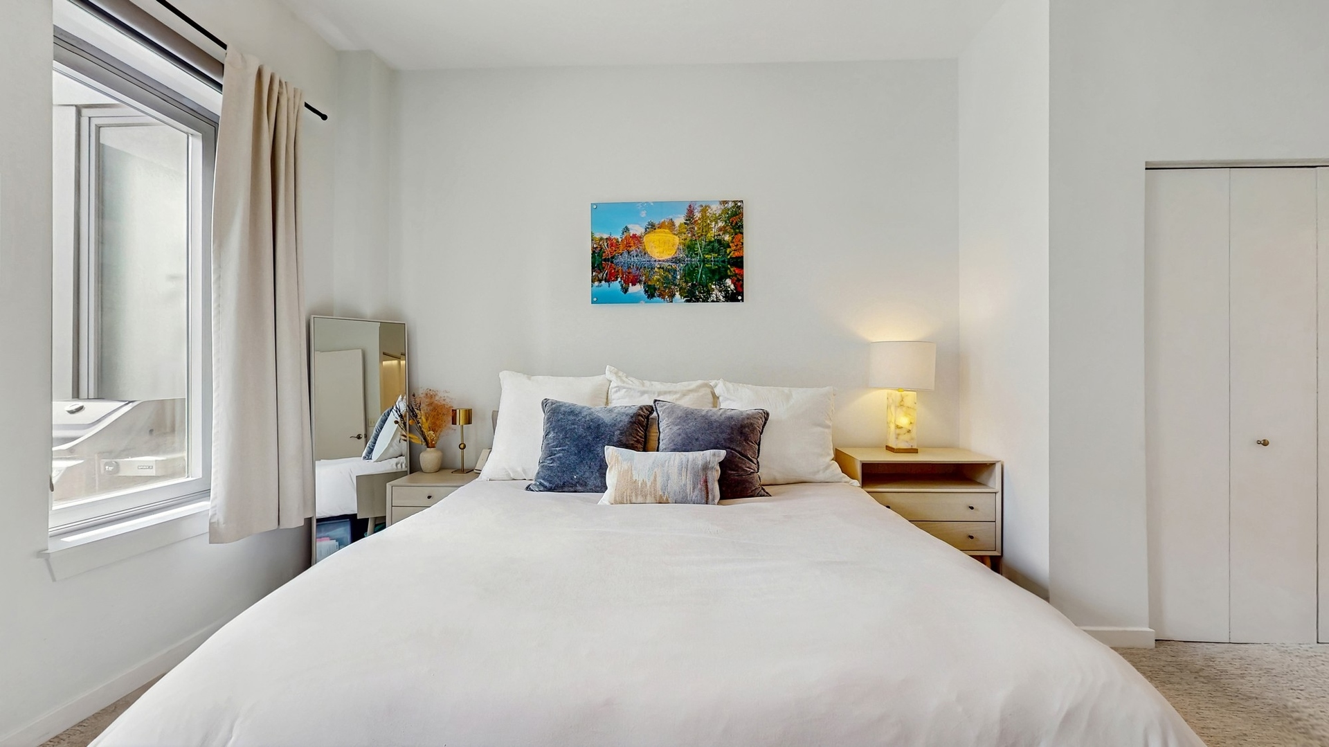3920 North Sheridan Road, Unit 411 Chicago, IL 60613 - Photo 19 of 28 a bedroom with a bed and wooden floor