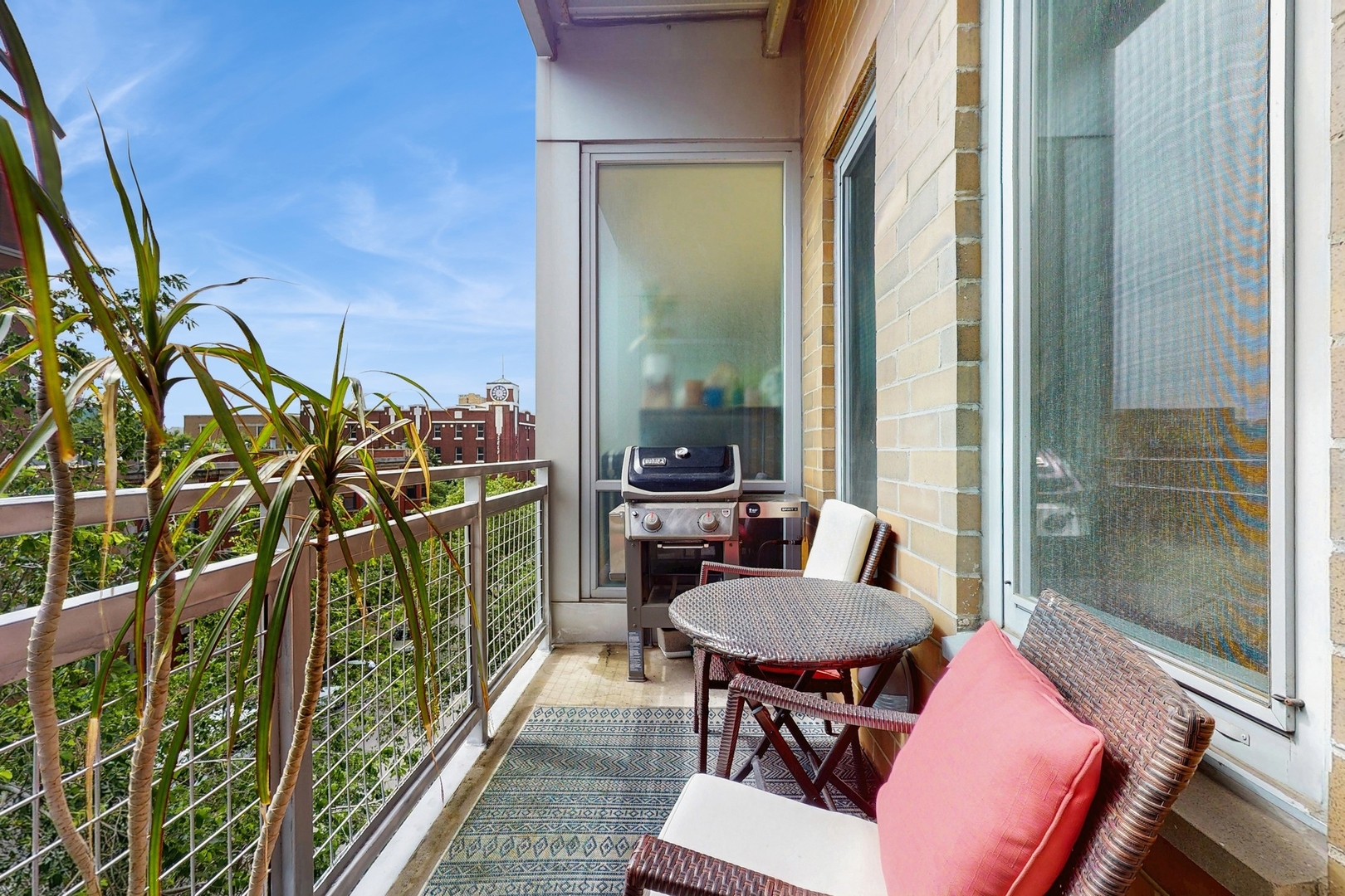3920 North Sheridan Road, Unit 411 Chicago, IL 60613 - Photo 2 of 28 a balcony with furniture and a potted plant