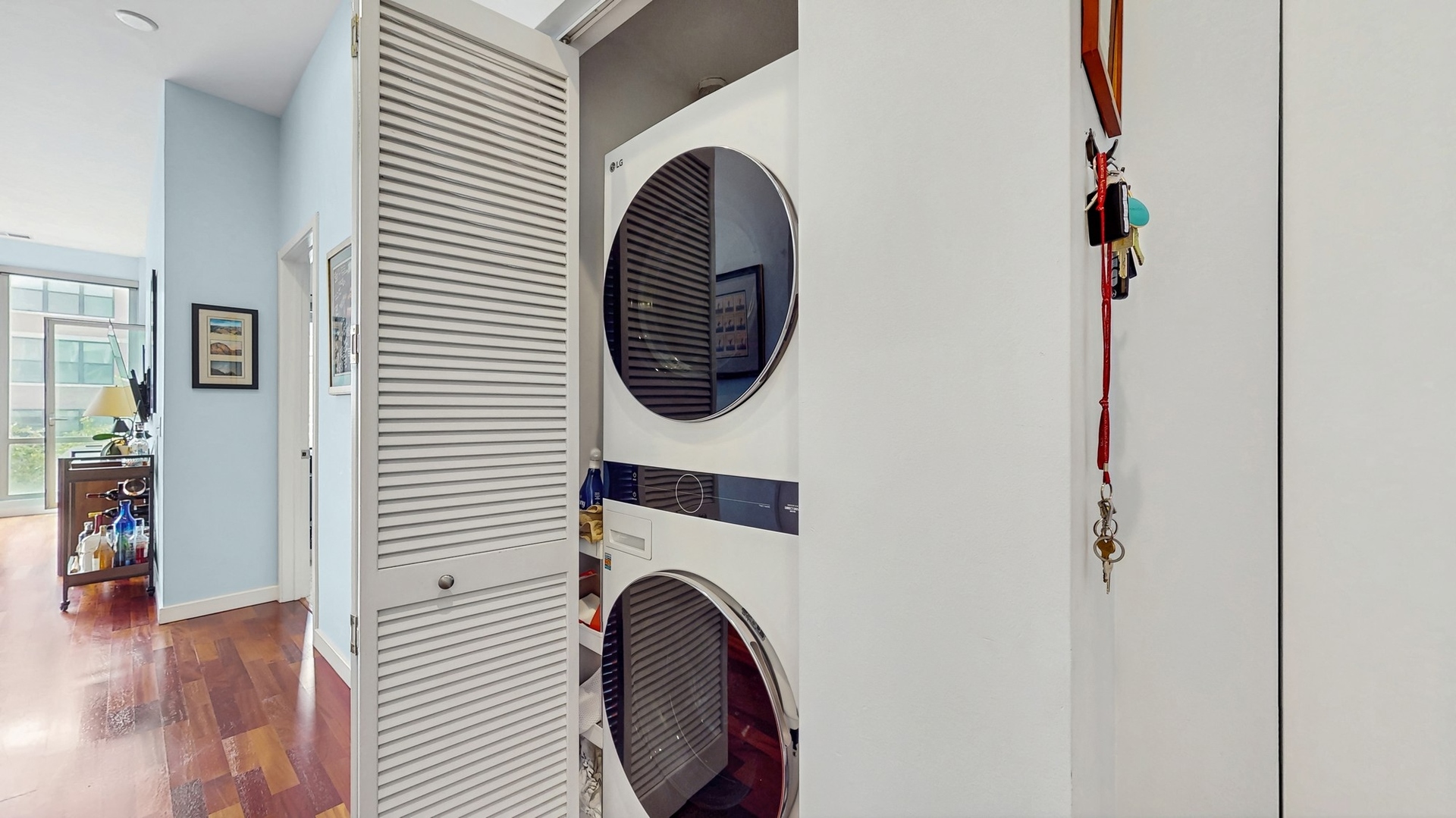 3920 North Sheridan Road, Unit 411 Chicago, IL 60613 - Photo 21 of 28 a view of a hallway with washer and dryer