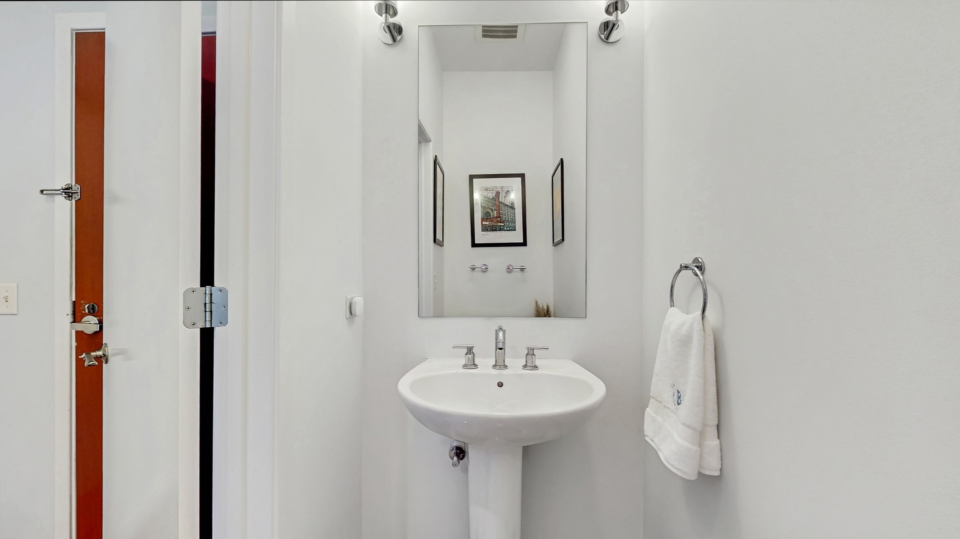 3920 North Sheridan Road, Unit 411 Chicago, IL 60613 - Photo 23 of 28 a bathroom with a sink and a mirror