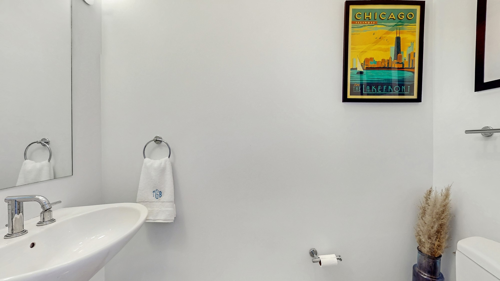 3920 North Sheridan Road, Unit 411 Chicago, IL 60613 - Photo 24 of 28 a bathroom with a sink and a mirror