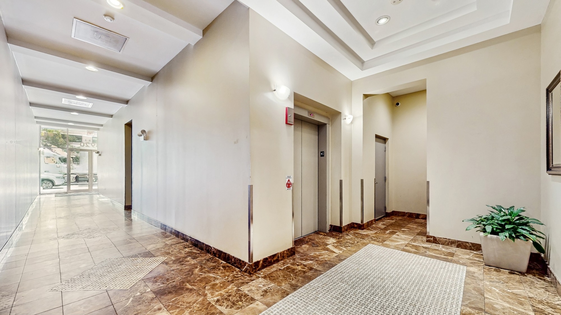 3920 North Sheridan Road, Unit 411 Chicago, IL 60613 - Photo 25 of 28 a bedroom with a bed and a view of bathroom