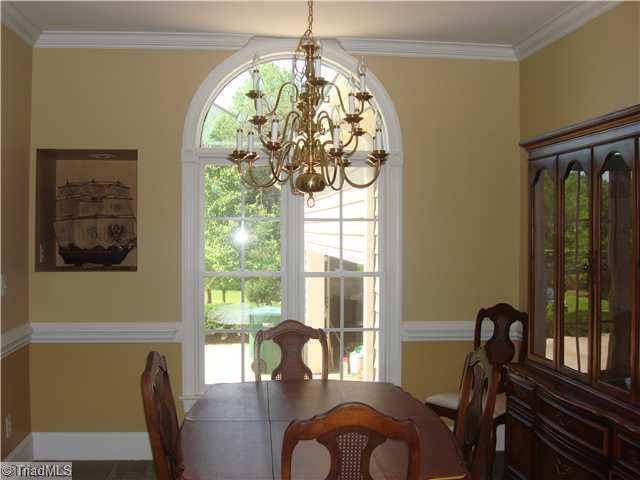 6365 Robinhood Road Pfafftown, NC 27040 - Photo 4 of 16 Dining Room. Columns, Crown Moulding, Chair Railing and a Built-in Niche all add character and charm to this formal dining room!