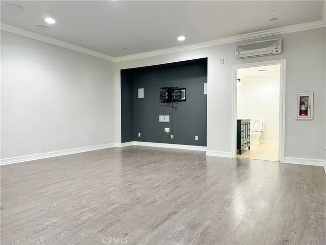 a view of a livingroom with wooden floor