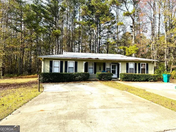a front view of a house with yard