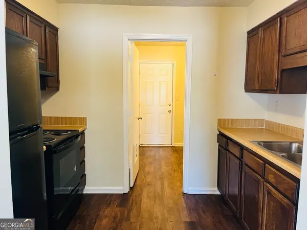 a kitchen with a stove and a refrigerator