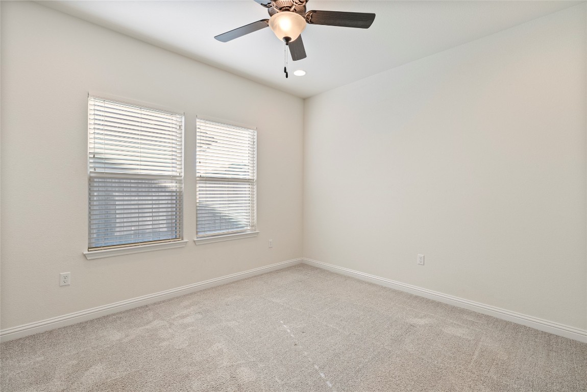 10708 Blacket Drive Austin, TX 78747 - Photo 14 of 20 a view of an empty room with a window