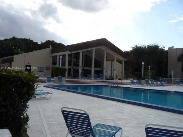 an aerial view of a house with a lake view