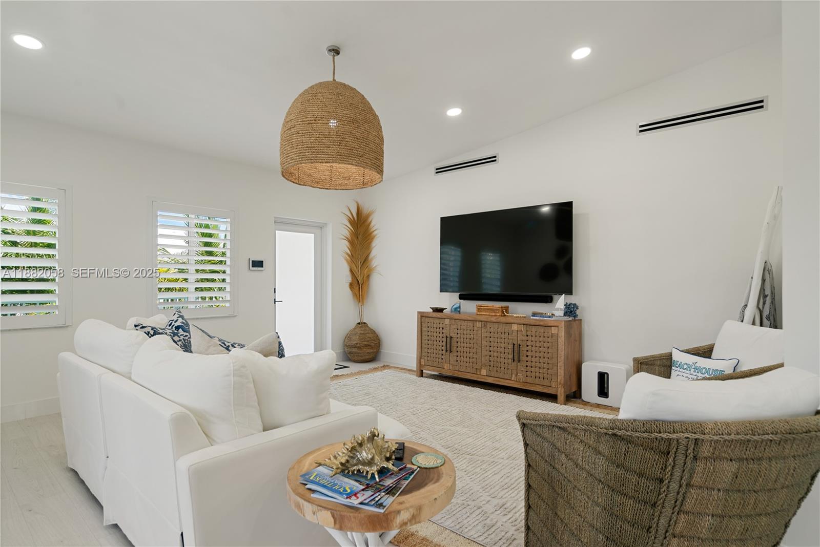 889 Ellen Drive Key Largo, FL 33037 - Photo 12 of 57 a living room with furniture and a flat screen tv