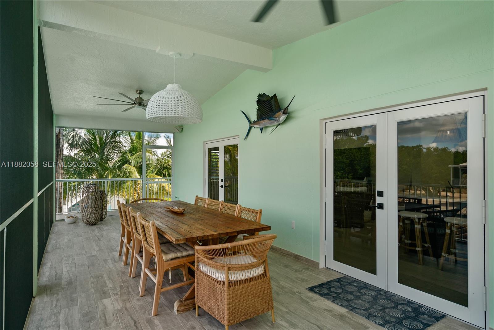 889 Ellen Drive Key Largo, FL 33037 - Photo 14 of 57 a living room with furniture and a large window