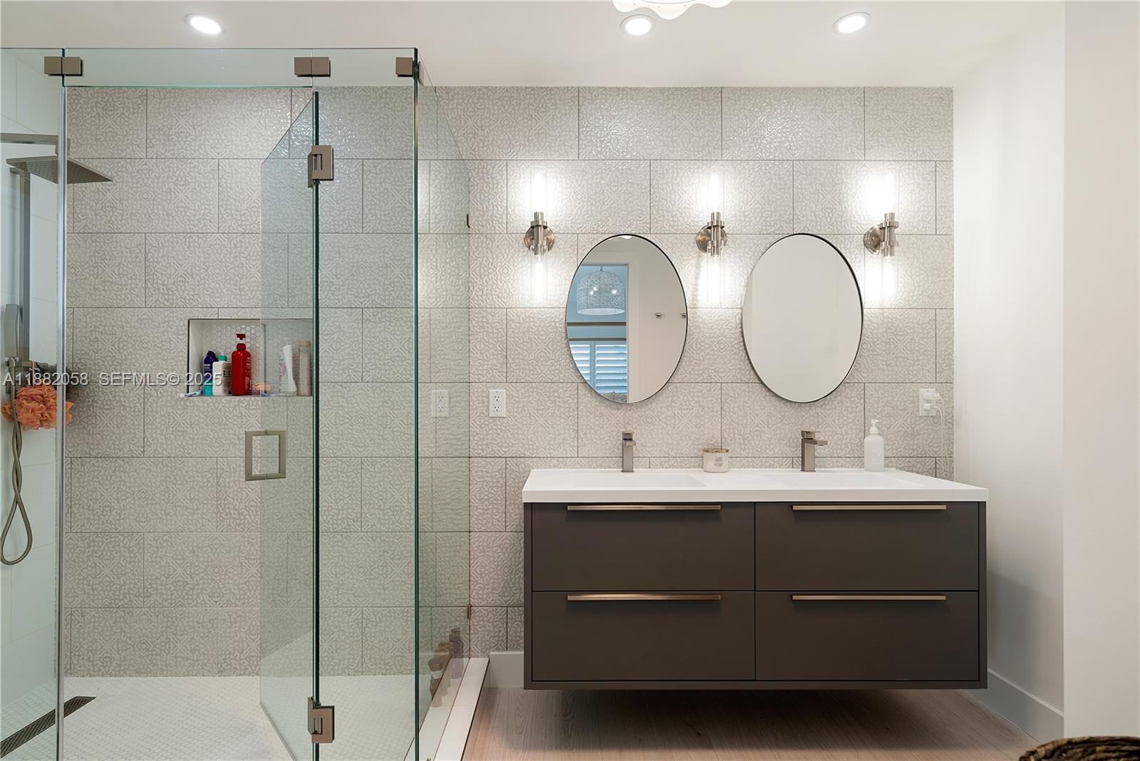 889 Ellen Drive Key Largo, FL 33037 - Photo 18 of 57 a bathroom with a double vanity sink mirror and shower