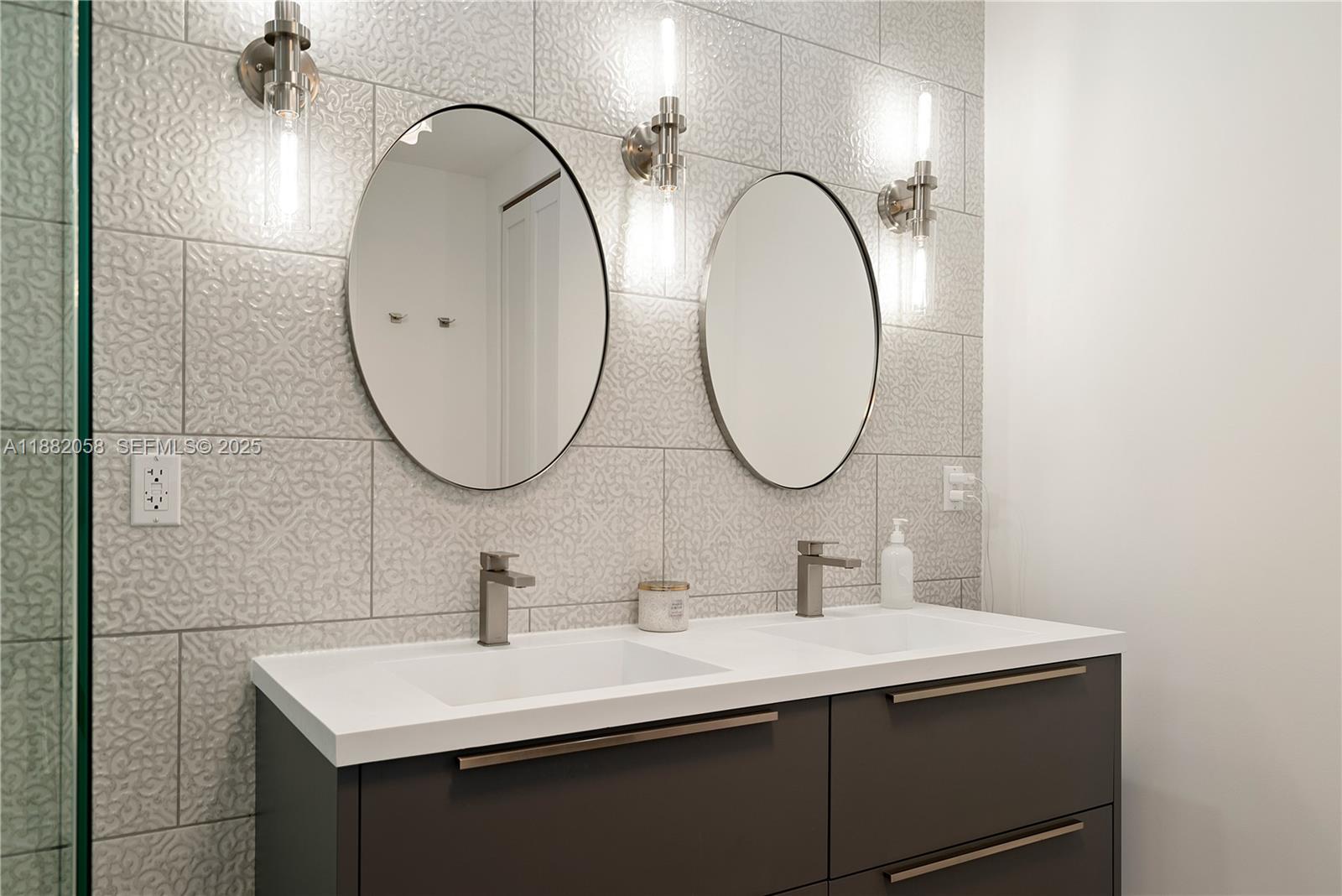 889 Ellen Drive Key Largo, FL 33037 - Photo 19 of 57 a bathroom with a sink and a mirror