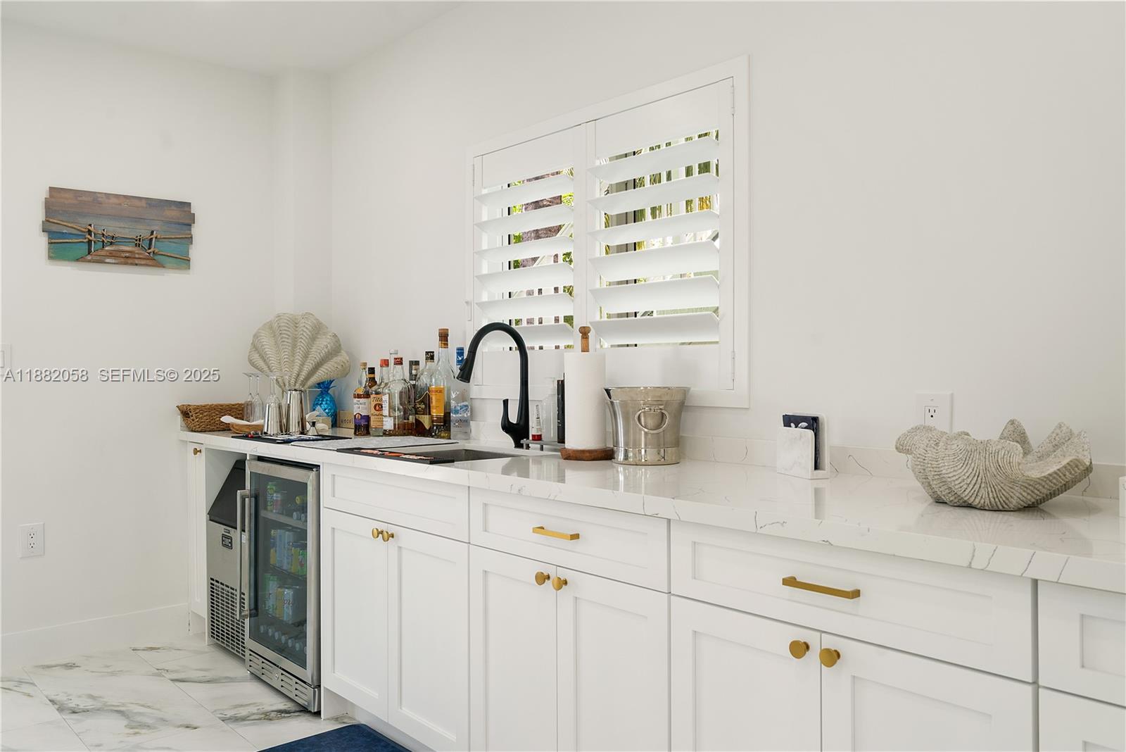 889 Ellen Drive Key Largo, FL 33037 - Photo 28 of 57 a kitchen with a sink and cabinets