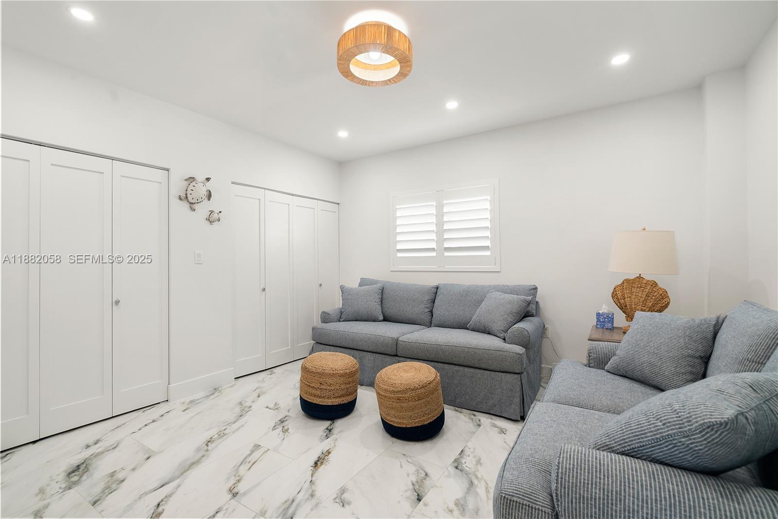 889 Ellen Drive Key Largo, FL 33037 - Photo 30 of 57 a living room with furniture and a window