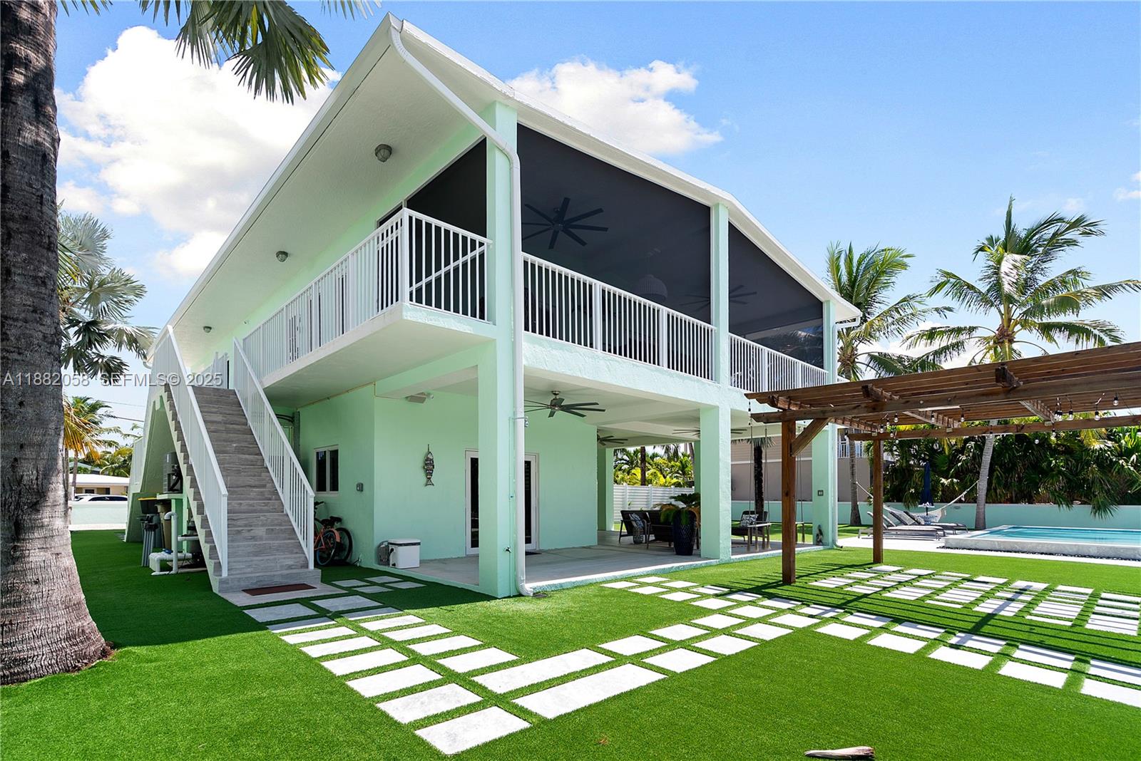 889 Ellen Drive Key Largo, FL 33037 - Photo 32 of 57 a view of a house with a yard