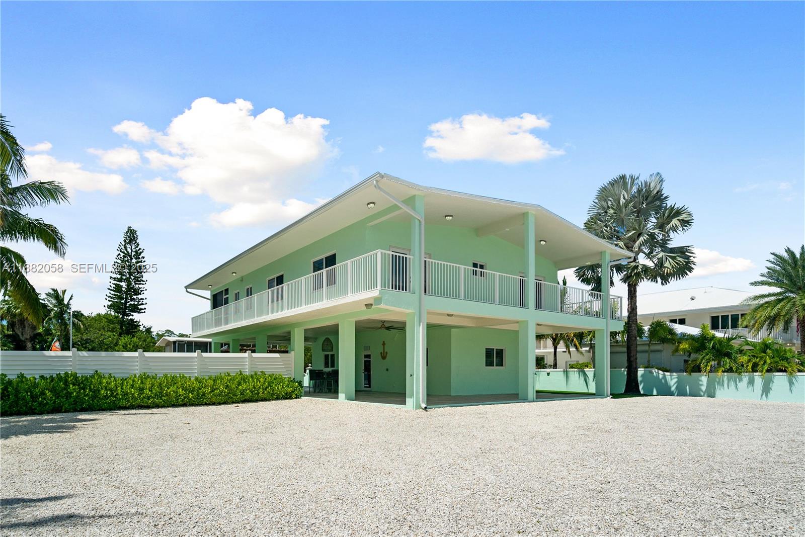 889 Ellen Drive Key Largo, FL 33037 - Photo 38 of 57 a front view of a building with a yard