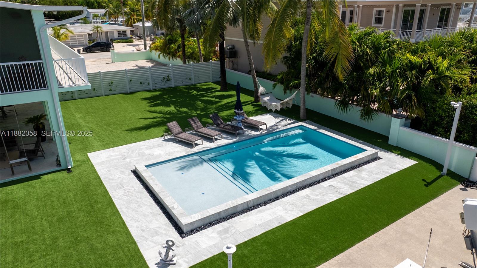 889 Ellen Drive Key Largo, FL 33037 - Photo 39 of 57 a view of a backyard with sitting area