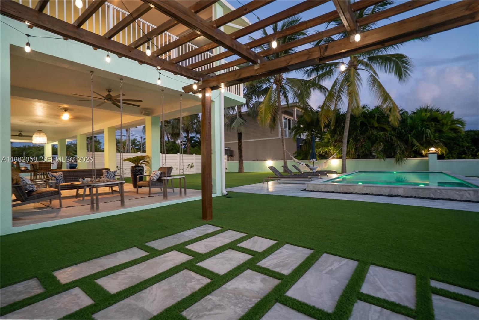 889 Ellen Drive Key Largo, FL 33037 - Photo 47 of 57 a view of a backyard with sitting area