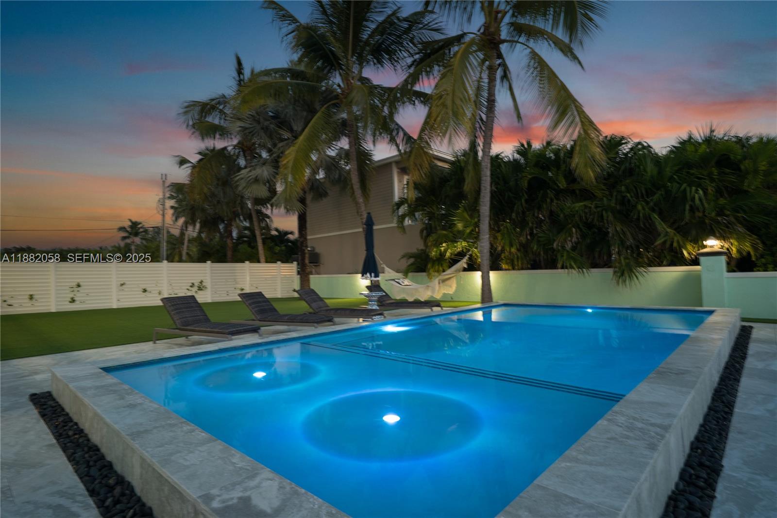 889 Ellen Drive Key Largo, FL 33037 - Photo 49 of 57 a view of a swimming pool with a yard