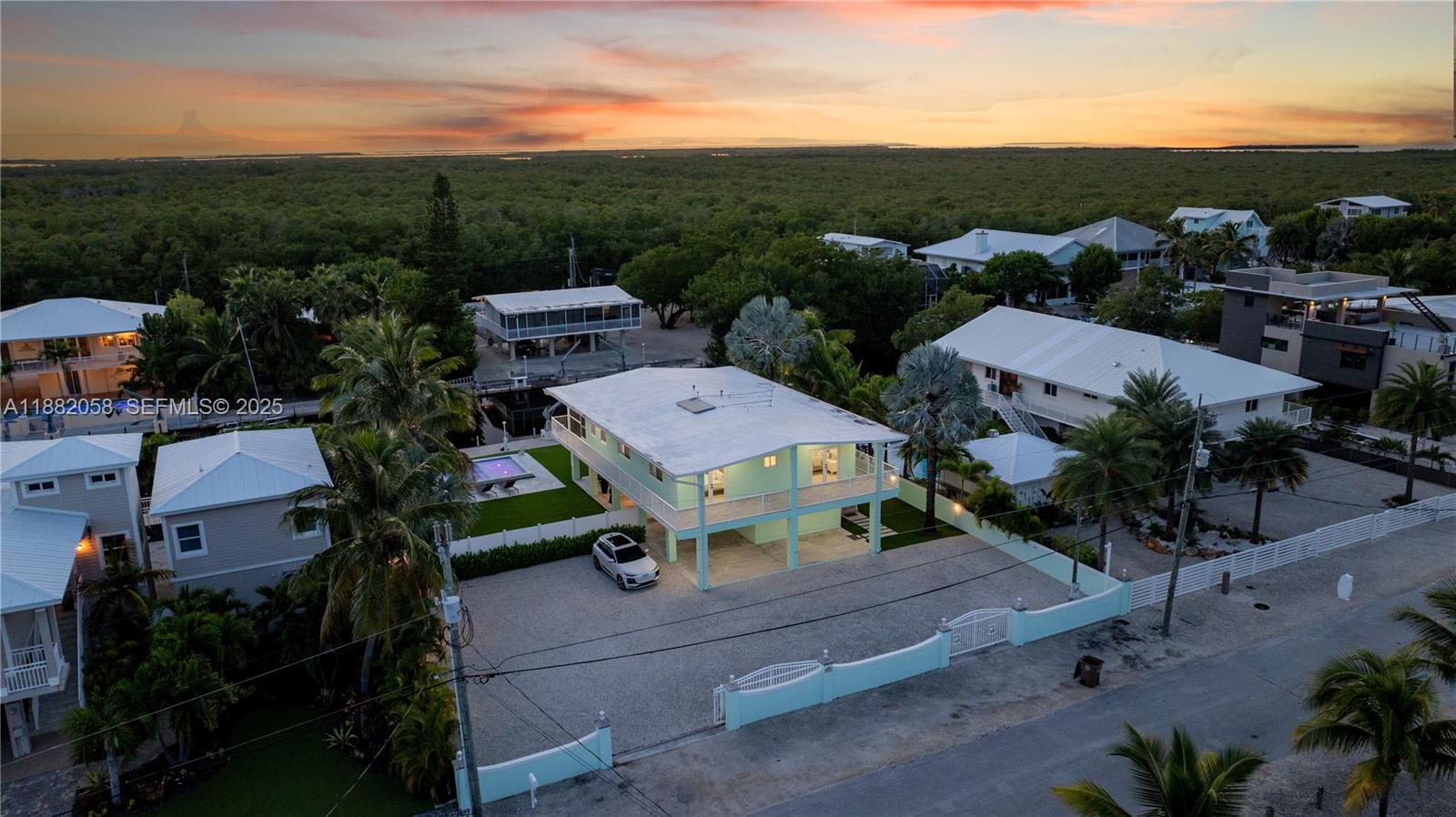 889 Ellen Drive Key Largo, FL 33037 - Photo 50 of 57 an aerial view of a house with a garden