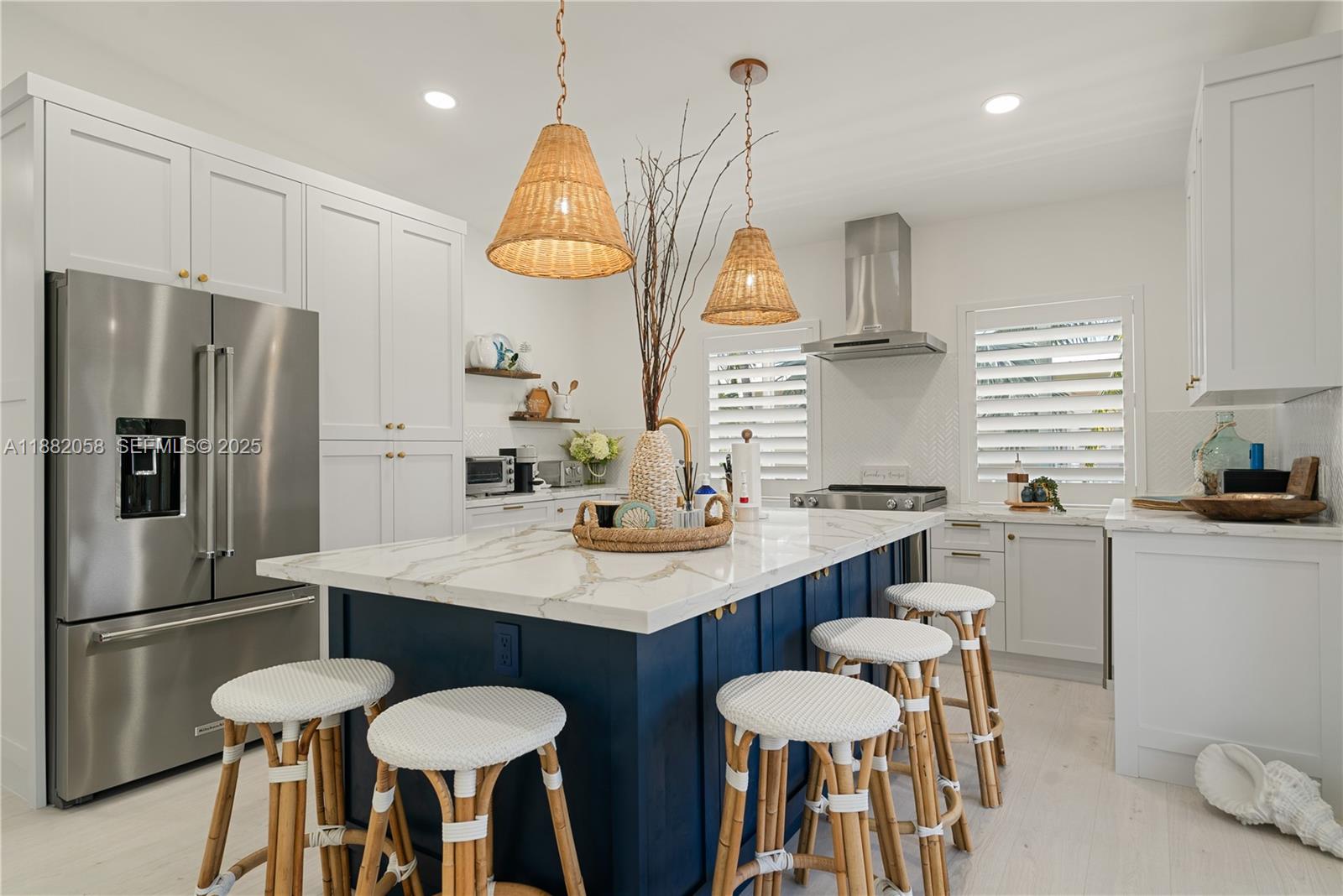 889 Ellen Drive Key Largo, FL 33037 - Photo 5 of 57 a kitchen with stainless steel appliances granite countertop a sink a stove a refrigerator cabinets and chairs