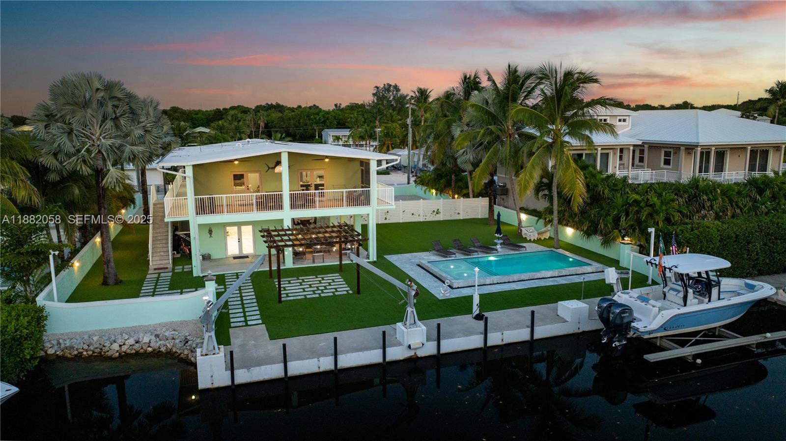 889 Ellen Drive Key Largo, FL 33037 - Photo 51 of 57 a view of a chairs and table in a patio