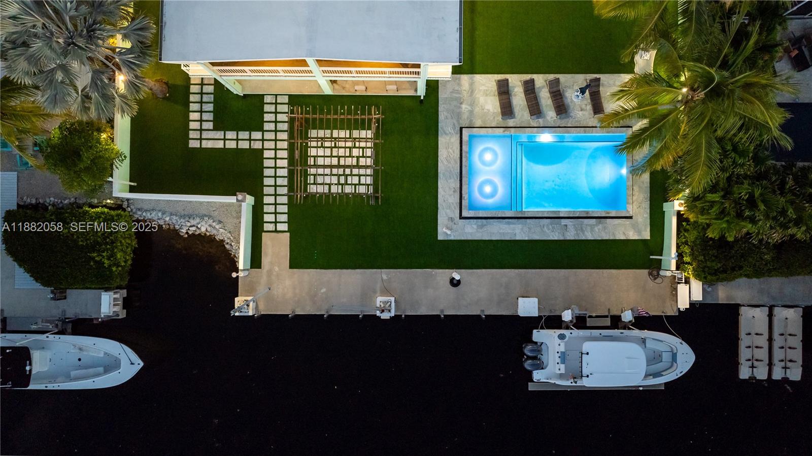 889 Ellen Drive Key Largo, FL 33037 - Photo 55 of 57 a living room with furniture and a fireplace