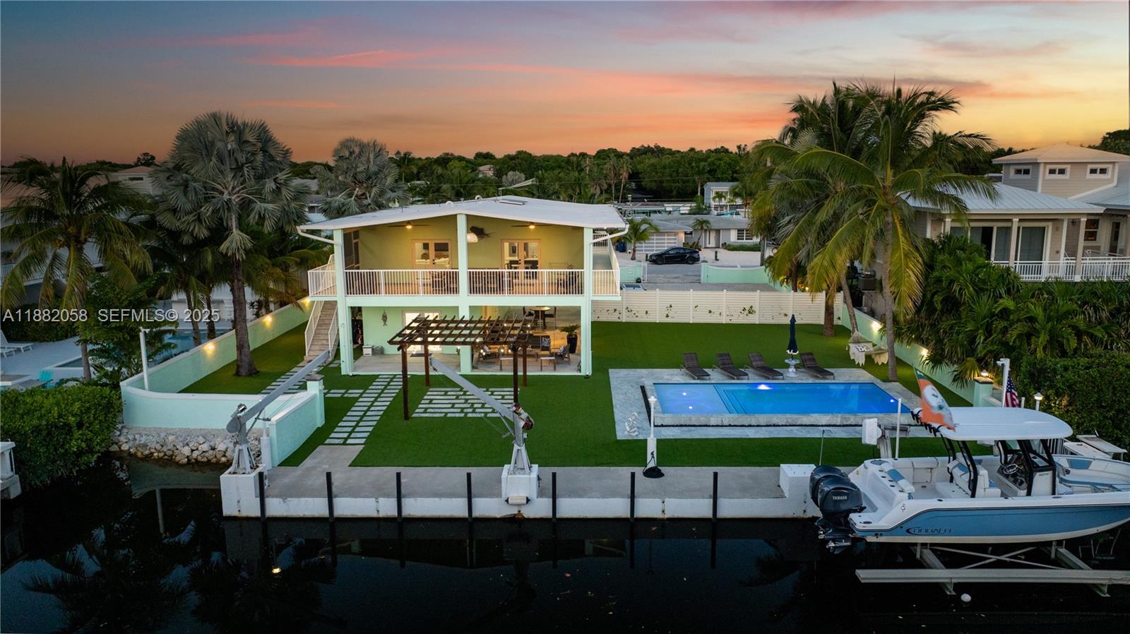 889 Ellen Drive Key Largo, FL 33037 - Photo 57 of 57 a view of a chairs and table in patio