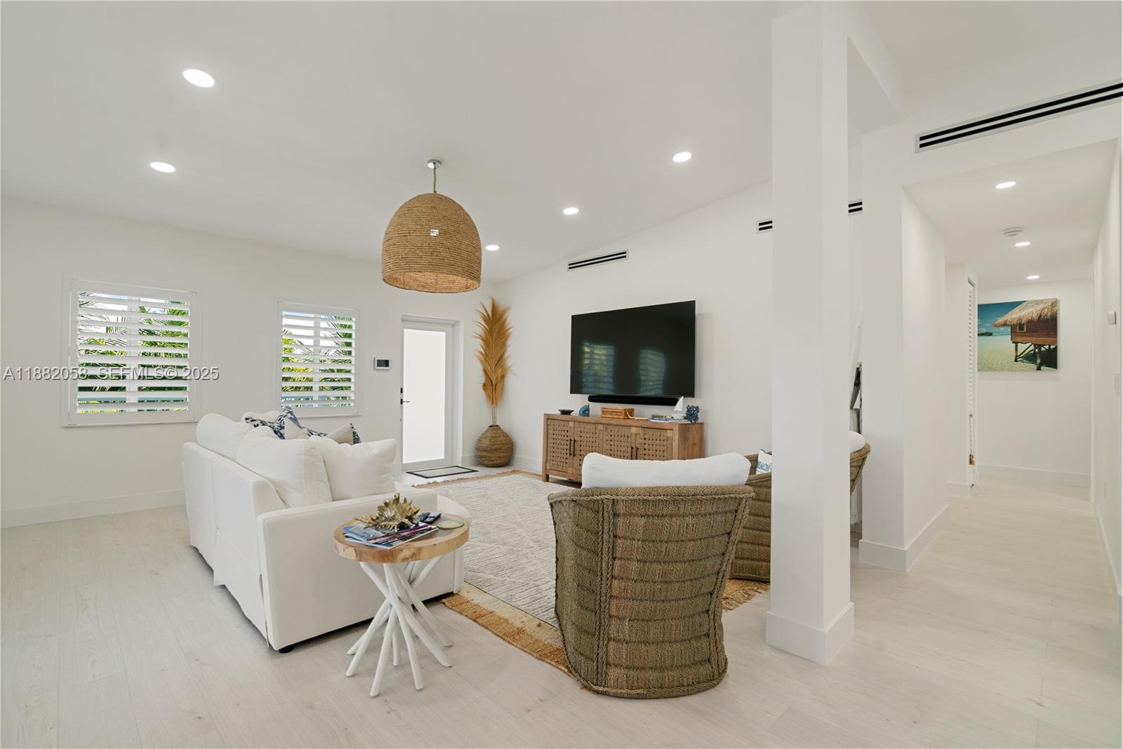 889 Ellen Drive Key Largo, FL 33037 - Photo 10 of 57 a living room with fireplace furniture and a flat screen tv