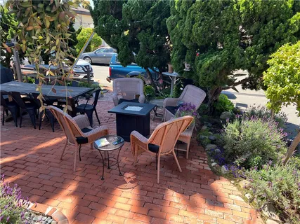 a view of a porch with chairs and backyard