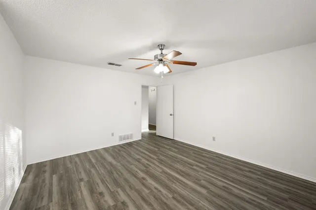 a bathroom with a shower and a toilet