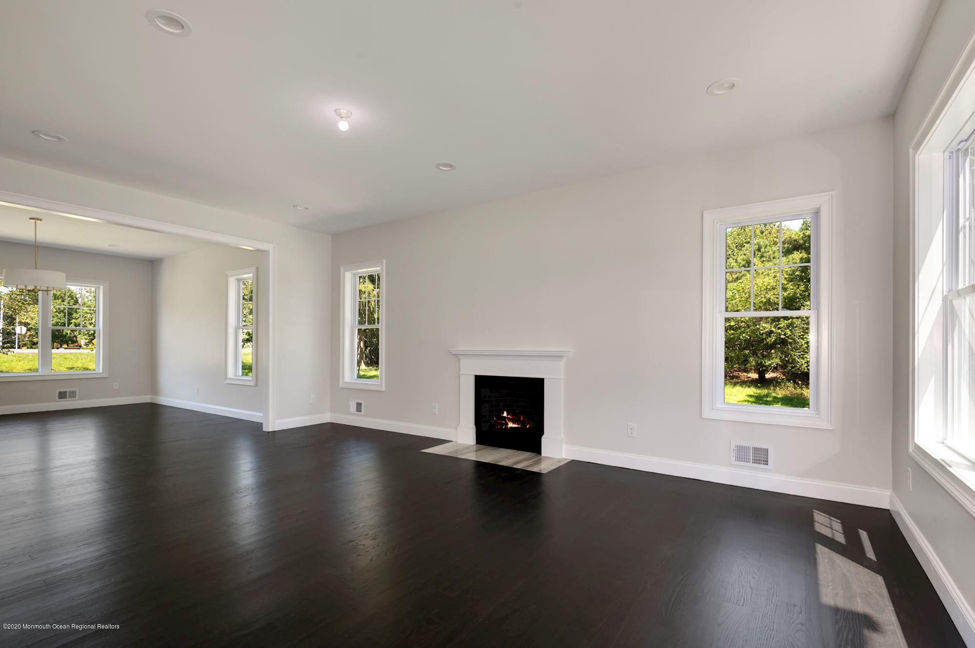 409 Jackson Mills Road Freehold, NJ 07728 - Photo 17 of 35 an empty room with windows and fireplace